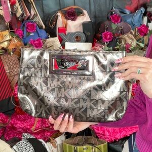 6. Michael Kors Signature Logo Clutch Bag
